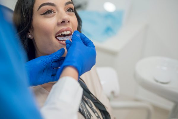 Dentist inserting orthodontic retainers, Nikon Z7